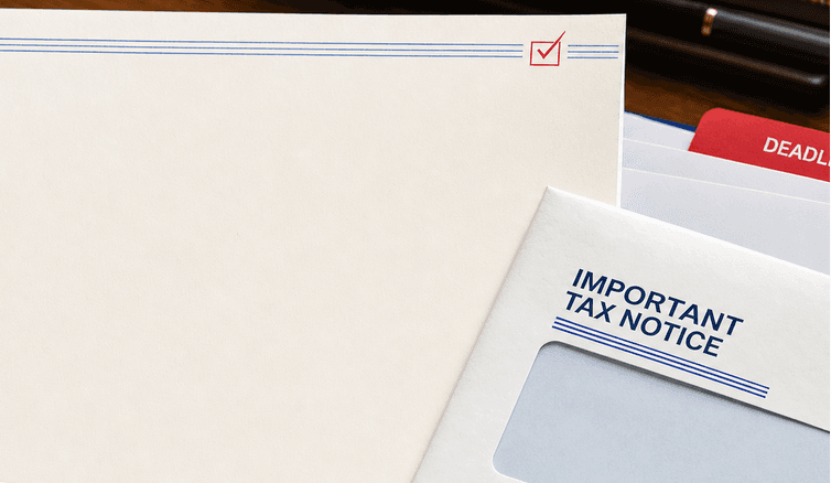 An IRS-style notice and its envelope on a private office desk, beside a blue case folder with a red deadline tab